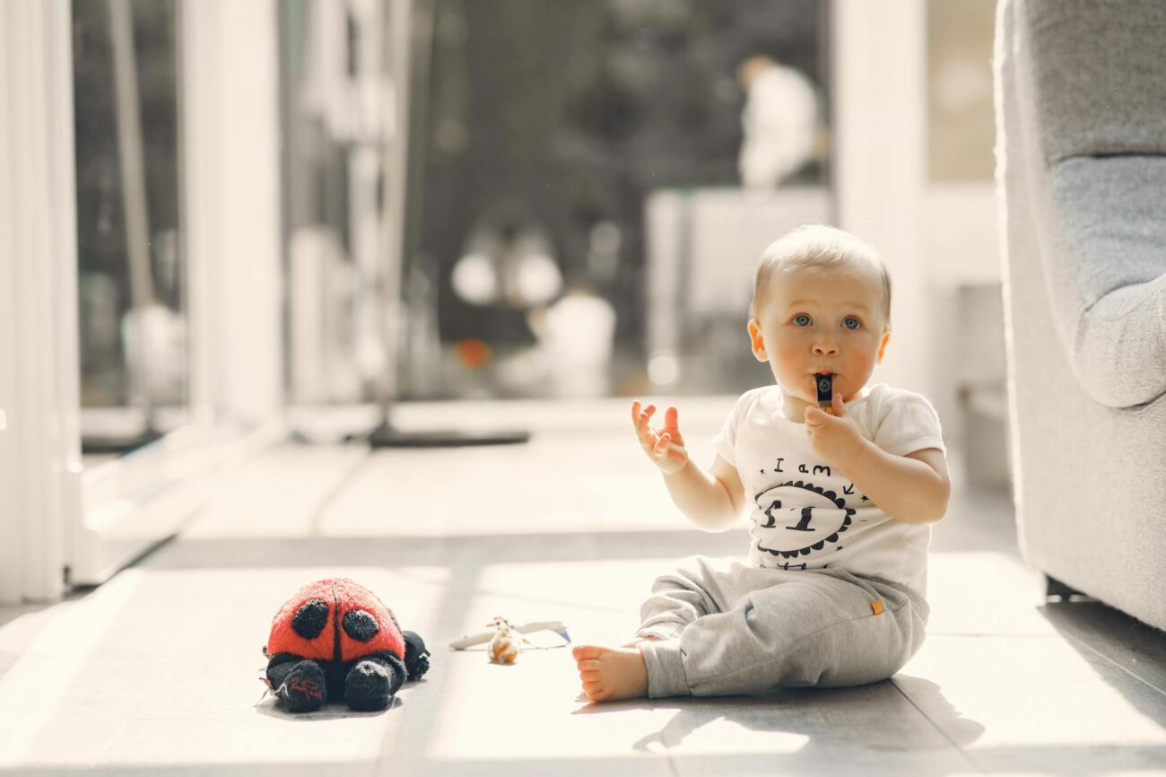 little boy blowing a whistle