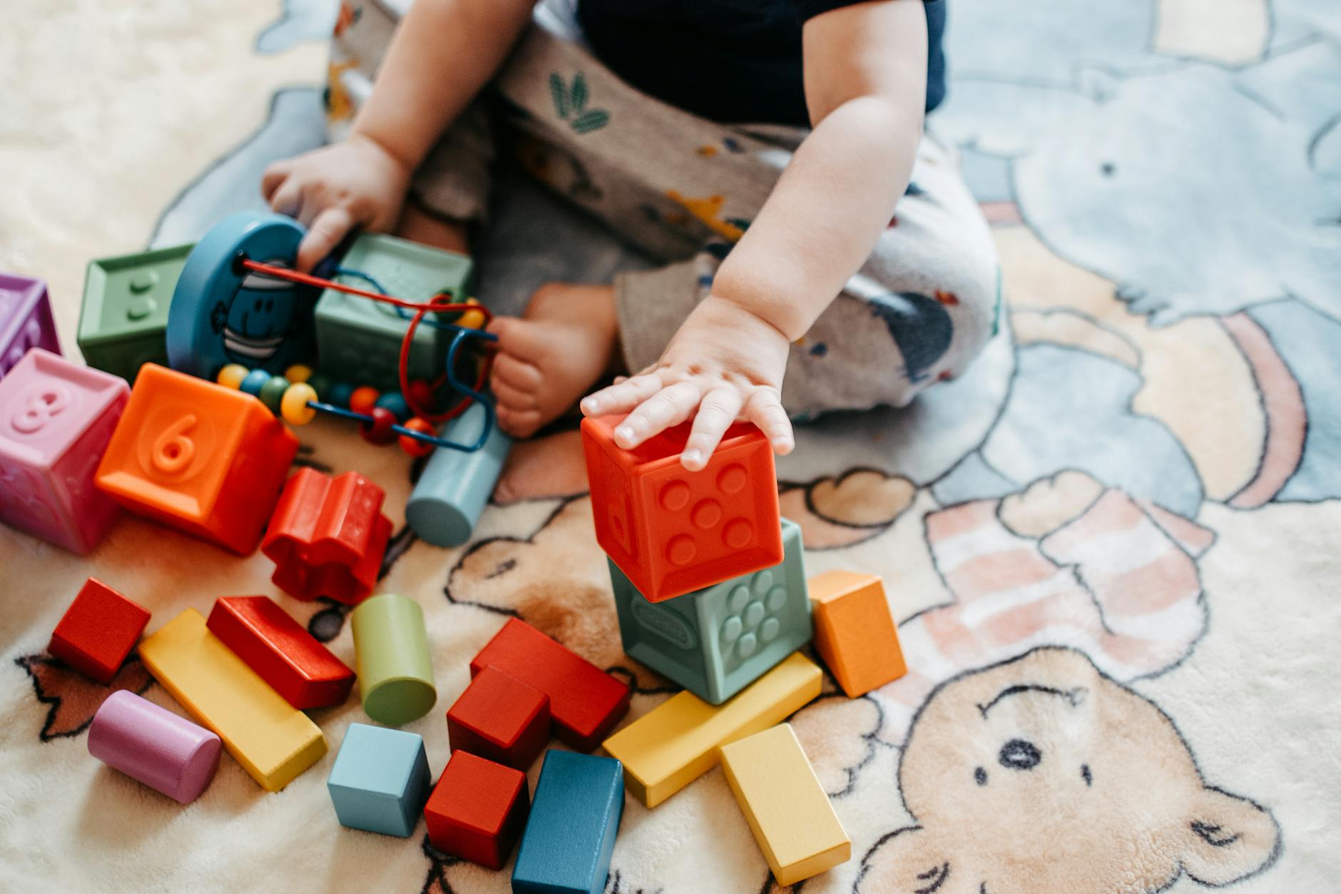 child playing with lego blocks