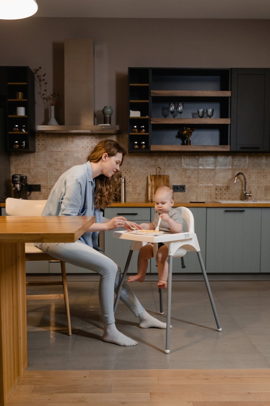 a woman feeding a child